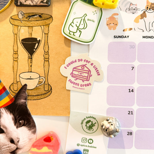Fridge magnet surrounded by a calendar and other magnets