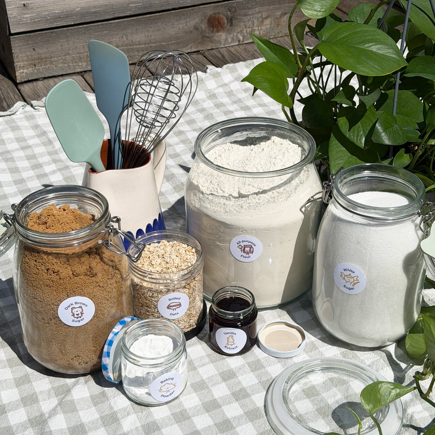 jars filled with baking ingredients with spice babies labels