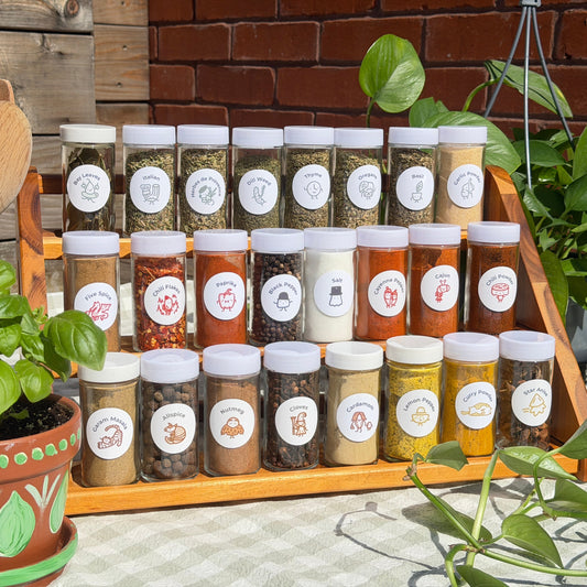Spice rack filled with various jars of spices with spice babies labels on them.